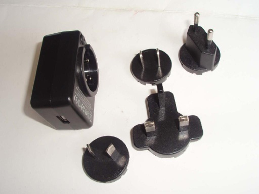 Interchangeable plug power adapter with USB