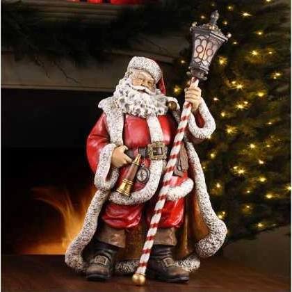 From the Christmas Traditions Collection Item #44036 Ornately detailed Santa figure stands holding a peppermint striped lantern Highlighted with bright gold paint