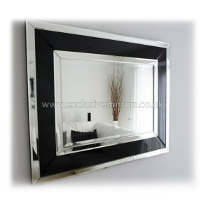 This large mirror has three layers of glass framing: two clear and one black, to create an art deco styled design.
