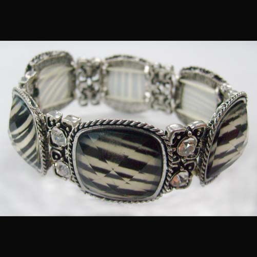 bracelet is made of alloy base with glass accessories.
