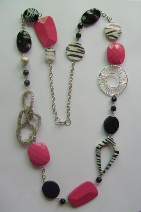 Necklace is made of shell,black and pink acrylic beads.