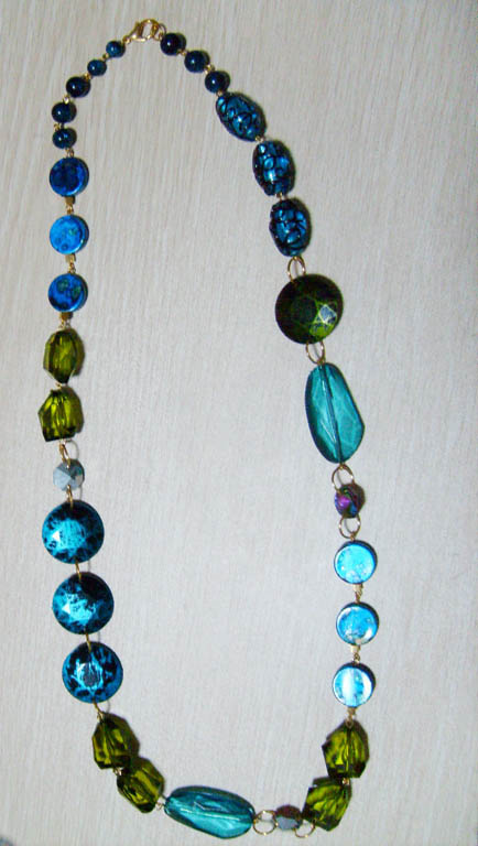 Necklace is made of glass bead and acrylic bead.
